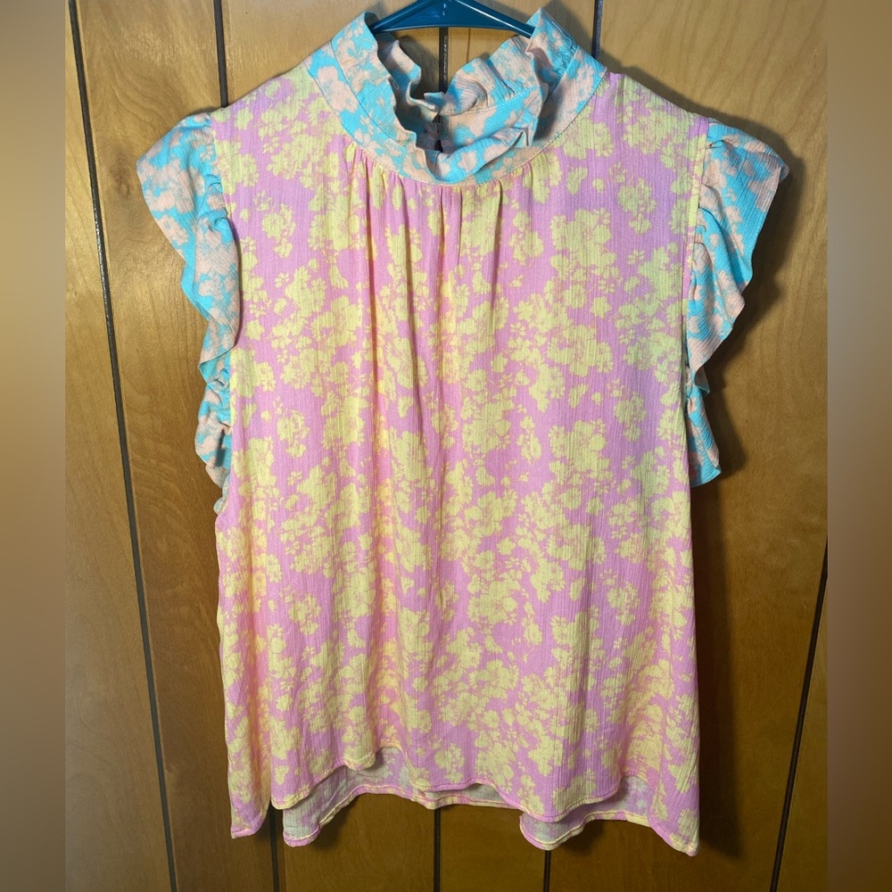 Karlie top, size large. Lightweight. Multicolored, button detail on the back.